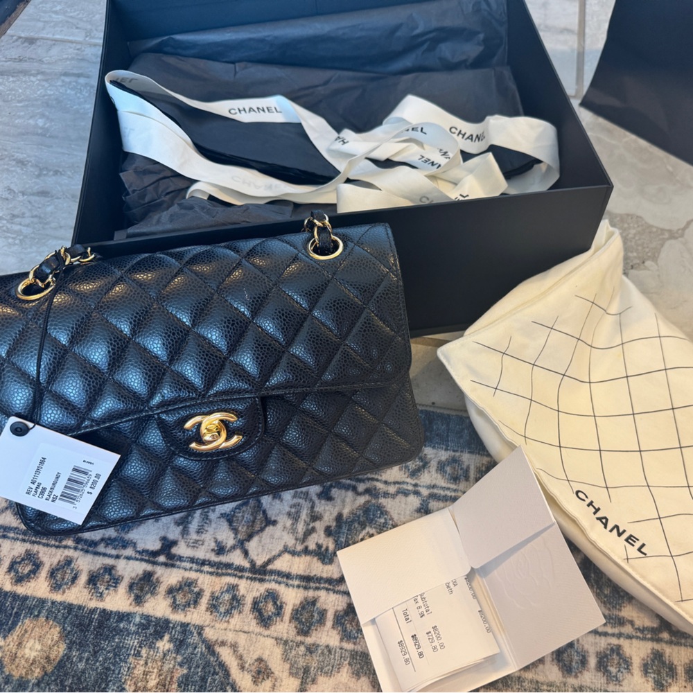 CHANEL Black Quilted Handbag with Gold Accents
